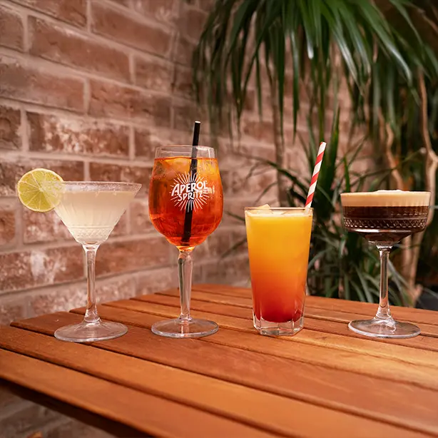 A selection of refreshing dinner drinks at La Mela Bistro, perfect to complement your Mediterranean meal in Hackney.